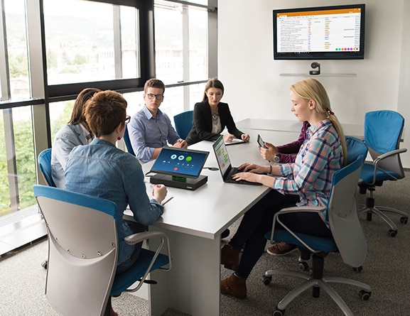A team of people in a meeting using ThinkSmart Hub 500