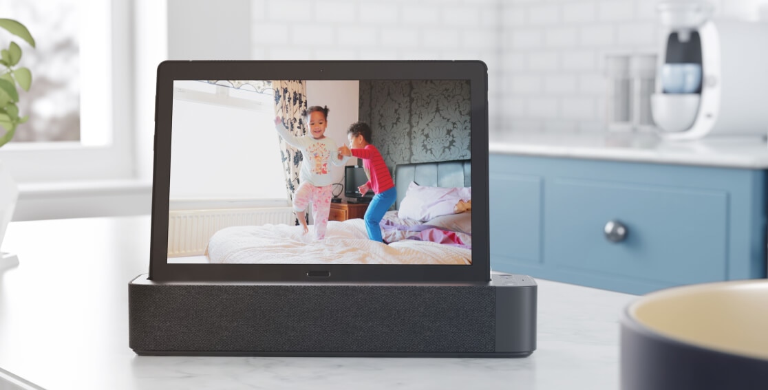Lenovo Tab with Smart Dock showing a family photo