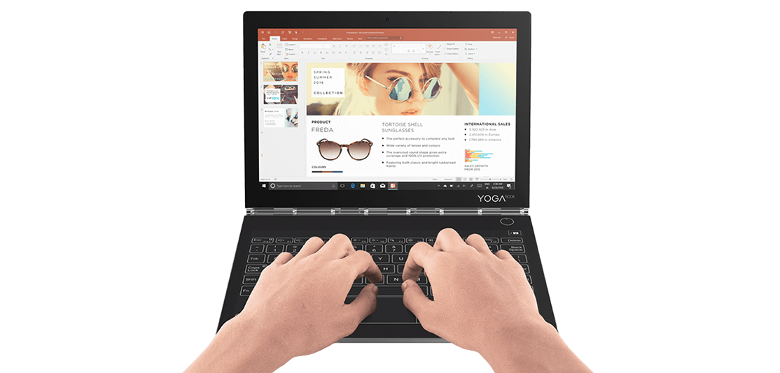 Lenovo Yoga Book C930 front view with hands typing on keyboard.