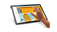 Lenovo Yoga Tab 11 tablette-3/4 vue de face gauche, avec catalogue de vêtements en ligne sur l’écran et la main droite d’une personne sur le point de toucher une sélection