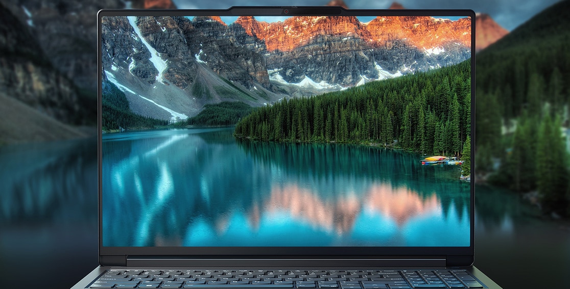 Stunning visual of snow-capped mountains & river on the display of the Lenovo ThinkBook 16p Gen 4 laptop & surrounding the device, which appears to be floating atop the river.