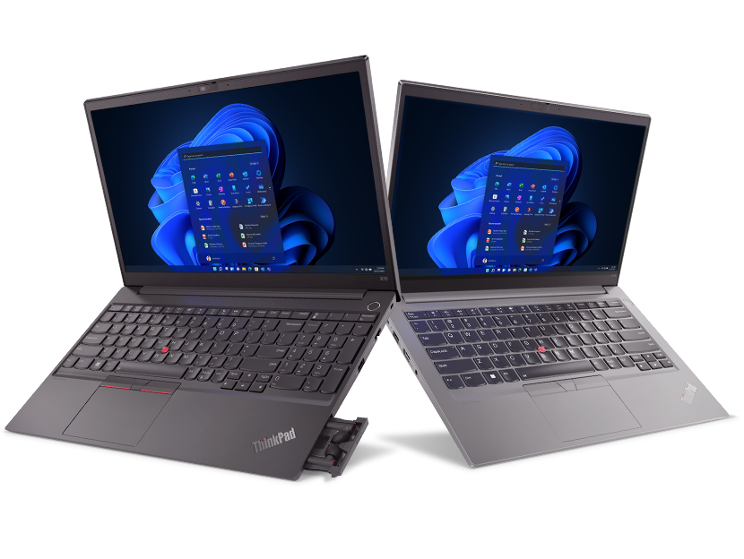 Two Lenovo ThinkPad E series laptops, side by side, opened 90 degrees, both showing display with Windows 11  & keyboard.