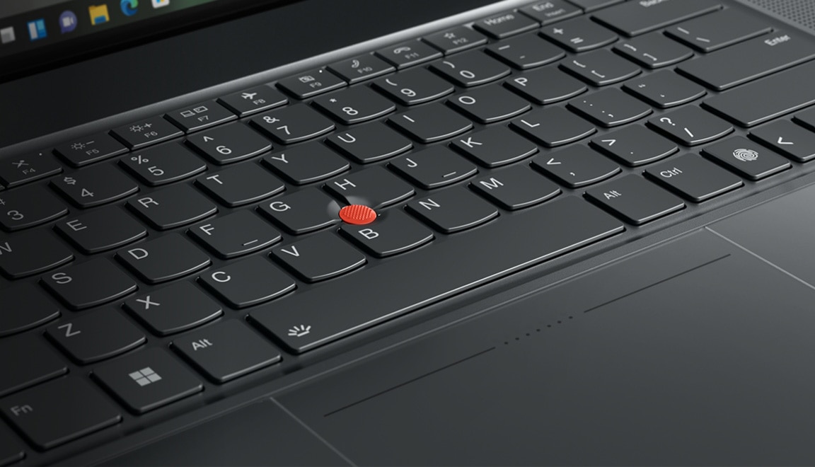 Detail of keyboard with glass TrackPad and dual-function TrackPoint on the Lenovo ThinkPad Z16 laptop.