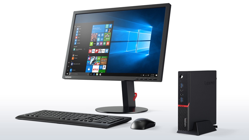 Lenovo ThinkCentre M900 Tiny, front right side view with monitor, keyboard, and mouse