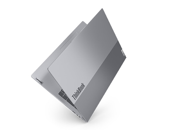 Lenovo ThinkBook 16 Gen 6 laptop with cover nearly closed& facing upright, as if on the binding like a book.